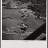 Air view. Farm with town of Lincoln in distance. Lincoln, Vermont.