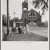 Old man and his wife preparing their popcorn roaster in front of the town hall. Bristol, Vermont.