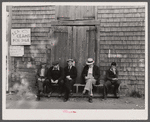 The "Sand Bar Club," a bench on the waterfront main street which is occupied all day by fishermen, unemployed fishermen and other residents with nothing to do; here they gossip, whittle, and make remarks about passing tourists. Provincetown, Massachusetts