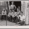 Fishermen hanging around in front of workshop of former fisherman who is now a builder of pleasure boats for tourists. Provincetown, Massachusetts.