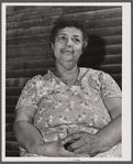 Tourist house, Truro. Portuguese woman from the Cape Verde Islands, wife of the disabled fisherman and railroad worker, now rents rooms to and boards tourists. Truro, Massachusetts.