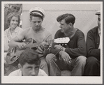 Local talent makes music on a Sunday afternoon under soldiers' monument. Provincetown, Massachusetts.