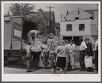 Distribution of surplus commodities near the railroad station. Huntingdon, Pennsylvania.