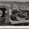 Compressor truck and quarry worker. Limestone quarry near Frederick, Maryland.