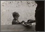 Small boy at mealtime in the camp for white flood refugees, Forrest City, Arkansas.