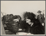 Woman at mealtime in the camp for white flood refugees, Forrest City, Arkansas.
