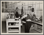 Workers in the vacuum cleaner factory at Reedsville, West Virginia.