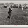 Boy playing with kite in front of Washington Monument. Washington, D.C.