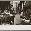 Hovel home of two Negro families, Washington, D.C. Near ice chest is the privy, although unseen in this picture. A recent relief visit accounts for the food on the table.