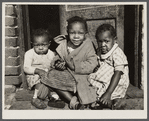 Negro children in doorway of alley home. Logan Alley, Northwest Washington, D.C.
