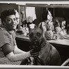 Billie Holiday and her dog Mister in dressing room