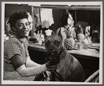 Billie Holiday and her dog Mister in dressing room