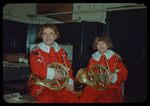 French horn players Mario Ricci and Tullio Tutrinoli in costume for Don Giovanni at the Metropolitan Opera