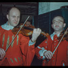 Violinist Ernest Drucker and viola player Theodore Ratner in costume for Don Giovanni at the Metropolitan Opera