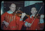 Violinist Ernest Drucker and viola player Theodore Ratner in costume for Don Giovanni at the Metropolitan Opera