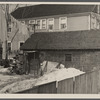 Garage in foreground is home of white family, man and wife. Manville, New Jersey.