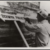 Carpenter or painter at work on the Berwyn project,  [Greenbelt,] Maryland.