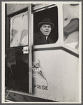 Administrator Tugwell at window of blimp before taking off.