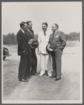 Resettlement Administrator R.G. Tugwell (in white), with his aides John O. Walker, John L. Lansill, and Frank Schmidt, inspects progress made at Greenbelt, Maryland,