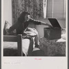 Arlington, Virginia. A girl in her room playing a phonograph at Arlington Farms, a residence for women who work in the government for the duration of the war.