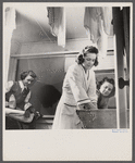 Arlington, Virginia. Washing clothes in one of the laundry rooms at Idaho Hall, Arlington Farms, a residence for women who work in the government for the duration of the war.