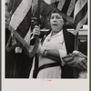 Arlington Cemetery, Arlington, Virginia. An American Legion color bearer singing "America" in the amphitheater.