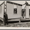 Placing house panels in place.  South East Missouri Farms.