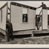 Placing house panels in place.  South East Missouri Farms.