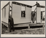 Placing house panels in place.  South East Missouri Farms.
