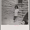 The mother said, "I keep her dressed nice every day because she is the only girl I've got." Great Western Sugar Company's beet sugar workers' colony at Hudson, Colorado.