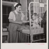 Washington, D.C. Mr. Lund, who is head of the District Red Cross, visits the Children's Hospital where General MacArthur's niece is a nurse's aid.