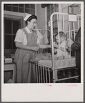 Washington, D.C. Mr. Lund, who is head of the District Red Cross, visits the Children's Hospital where General MacArthur's niece is a nurse's aid.