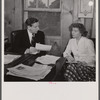 Washington, D.C. The Icelandic legation. Minister Thors dictating a letter to his niece Martha Thors, who is his secretary, in his office in the chancery. His home may be seen out the window.