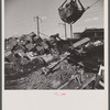 Washington, D.C. Scrap salvage campaign, Victory Program. Crane loads blocks of scrap metal onto a freight car in yard of wholesale junk company.