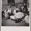 Washington, D.C. Scrap salvage campaign, Victory Program. Schoolchildren bring their scrap paper from their classrooms into the cellar, where it is picked up by paper company truck.