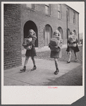 Washington, D.C. Scrap salvage campaign, Victory Program. Children bringing their weekly contribution of scrap paper to school.