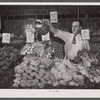 Washington, D.C. Watering vegetables to keep them fresh in the Giant Food shopping center on Wisconsin Avenue.