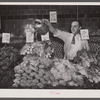 Washington, D.C. Watering vegetables to keep them fresh in the Giant Food shopping center on Wisconsin Avenue.