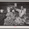Washington, D.C. Watering vegetables to keep them fresh in the Giant Food shopping center on Wisconsin Avenue.