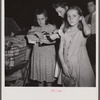 Washington, D.C. Customers getting out their sugar ration cards in the Giant Food shopping center on Wisconsin Avenue.