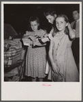 Washington, D.C. Customers getting out their sugar ration cards in the Giant Food shopping center on Wisconsin Avenue.