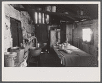 Kitchen and washroom of two room mountain shack, Route U.S. 11, a few miles east of Marshall, North Carolina.