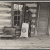 Tennessee mountain farmer near Crossville, Tennessee, with sack of "shorts."