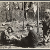 Three of the family of nine living in field in rough board covering built on old Ford truck chassis on U.S. Route 70, between Camden and Bruceton, Tennessee. Their water supply was an open creek running near state highway.