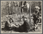 Three of the family of nine living in field in rough board covering built on old Ford truck chassis on U.S. Route 70, between Camden and Bruceton, Tennessee. Their water supply was an open creek running near state highway.