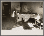 Kitchen of Negro dwelling in slum area near House office building, Washington, D.C.