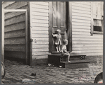 Small children in front of home, Georgetown, Washington, D.C.