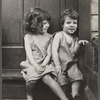 Small girls sitting in doorway of house in Georgetown, Washington, D.C.