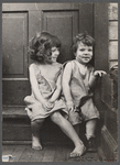 Small girls sitting in doorway of house in Georgetown, Washington, D.C.