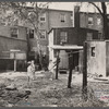 Children in slum area, Washington, D.C. Children in their backyard in a slum area near the Capitol. This area inhabited by both black and white.